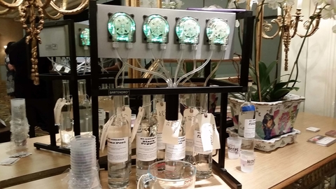 Robot bartender creating custom botanical spirits at Tales of the Cocktail - Robot bartenders